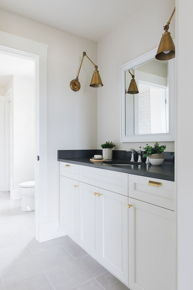 The Jack & Jill bathroom has a clean and uncomplicated design Trim and cabinet paint color is Benjamin Moore Simply White Walls are BM Classic Gray #Benjaminmoore
