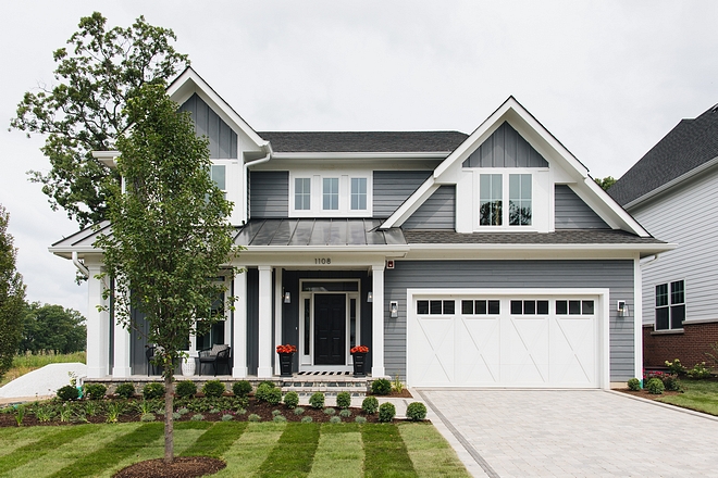 Grey Modern Farmhouse We traded the traditional white and black farmhouse for a dark grey facade We love how it pops off the white trim Grey Modern Farmhouse #GreyModernFarmhouse #ModernFarmhouse