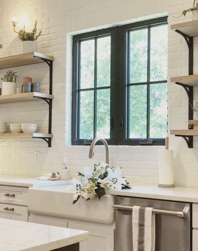 Painted Brick Backsplash Kitchen featuring painted white brick backslplash, black steel window and farmhouse sink #kitchen #brickbacksplash #paintedbrickbacksplash #whitebrick #brick #backsplash