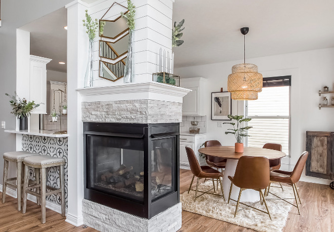 Fireplace Renovation Ideas A 3-sided fireplace brings warmth to the breakfast room and family room #FireplaceRenovation