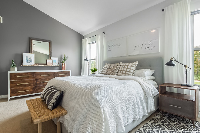 Mid-century farmhouse bedroom design We decided to flip the typical dark accent wall, with one light wall as the focal point instead
