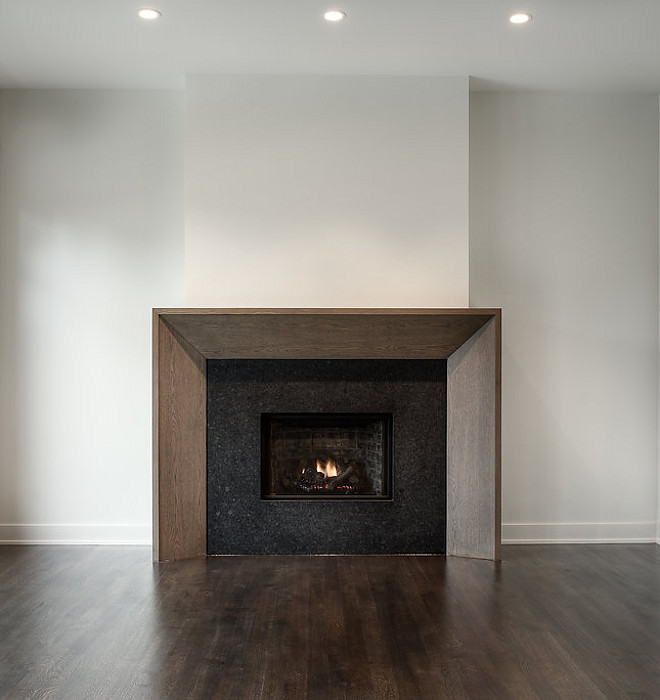 Sleek fireplace design Rough sawn White Oak Trim and Leathered Black Granite #fireplace #RoughsawnWhiteOak