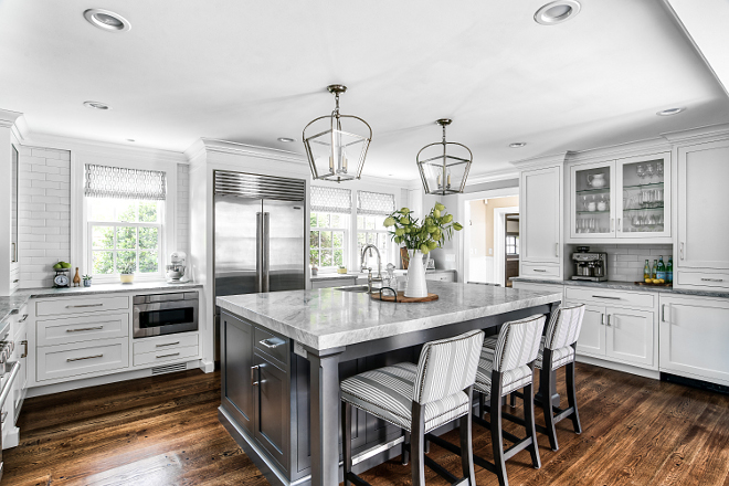 White kitchen with grey island This is not a big kitchen but it offers a great layout and plenty of storage and counter space #Whitekitchenwithgreyisland #Whitekitchen #greyisland