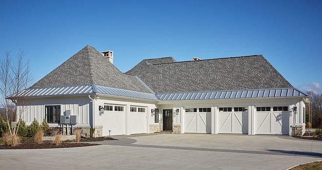Garage Large Garages Garage for 5 cars This side-entry 5-stall garage is perfectly tucked on the side of the house, not interfering with the architectural details of the facade #largegarages #garage #multiplecargarage #sideentrygarage #5stallgarage