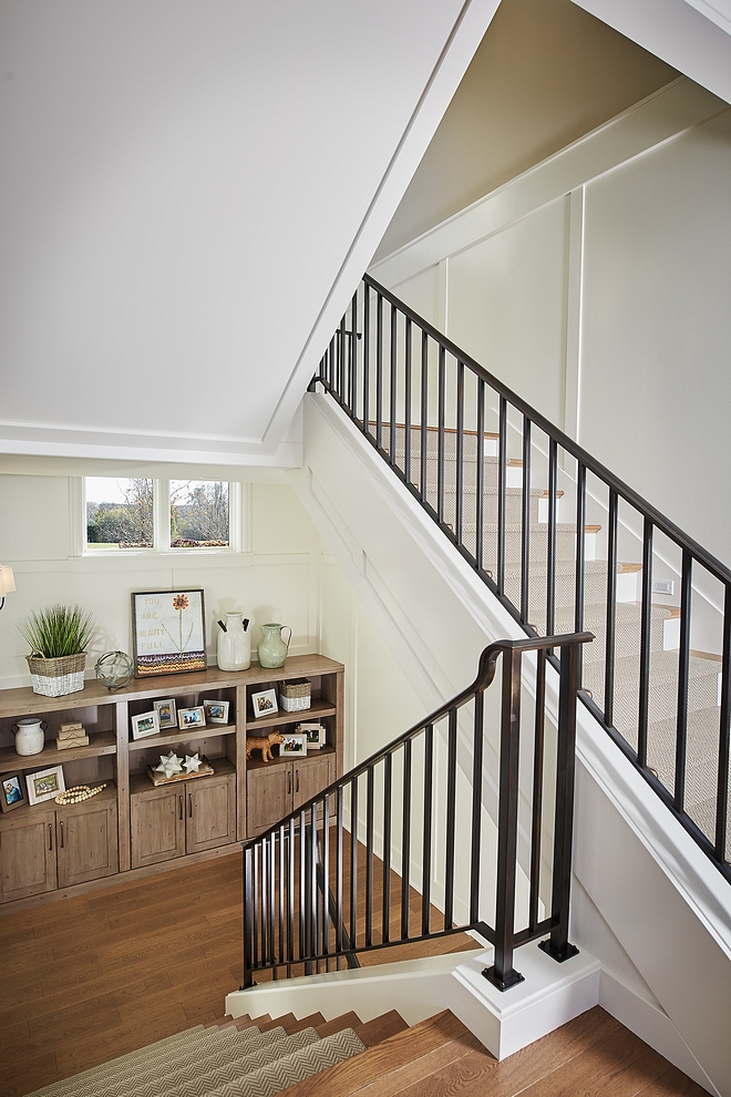 Benjamin Moore Swiss Coffee Staircase with horizontal board and batten paneling painted in Benjamin Moore Swiss Coffee Benjamin Moore Swiss Coffee #BenjaminMooreSwissCoffee #staircase #staircasepaneling #boardandbatten #paintcolor #paneling