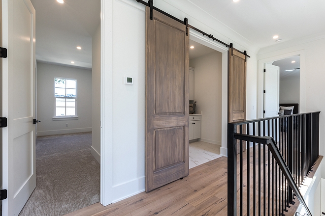 Second floor laundry room Upstairs, you will find a laundry room concealed with custom barn doors #laundrroom