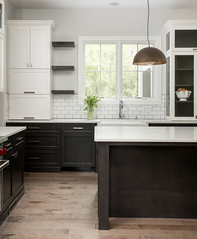 Two toned kitchen with white upper cabinets and dark stained lower cabinets The upper cabinets are painted in White Dove OC 17 Benjamin Moore #twotonedkitchen #whiteuppercabinet #WhiteDoveOC17BenjaminMoore