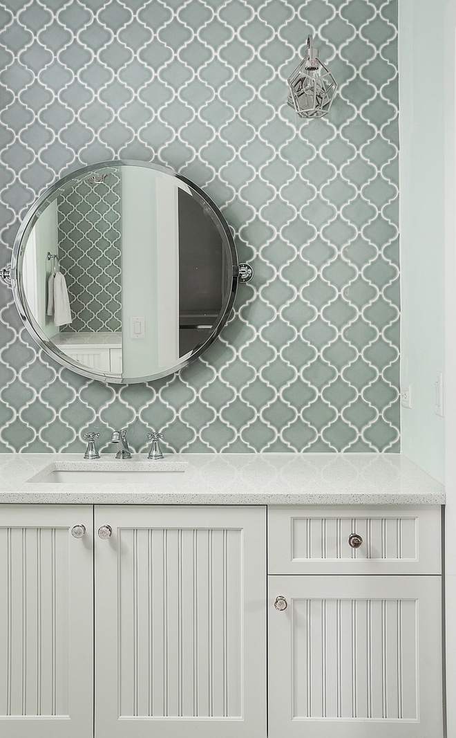 Bathroom Cabinet is Maple painted Benjamin Moore White Dove Countertop is quartz