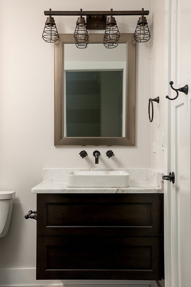 Industrial Bathroom Bathroom features industrial elements and a floating vanity #IndustrialBathroom #Bathroom #floatingvanity