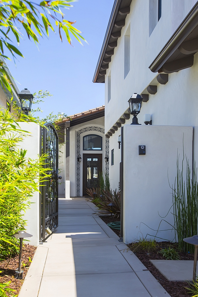 Courtyard A custom metal gate opens to a private Courtyard #Courtyard #Courtyardgate #gate #metalgate