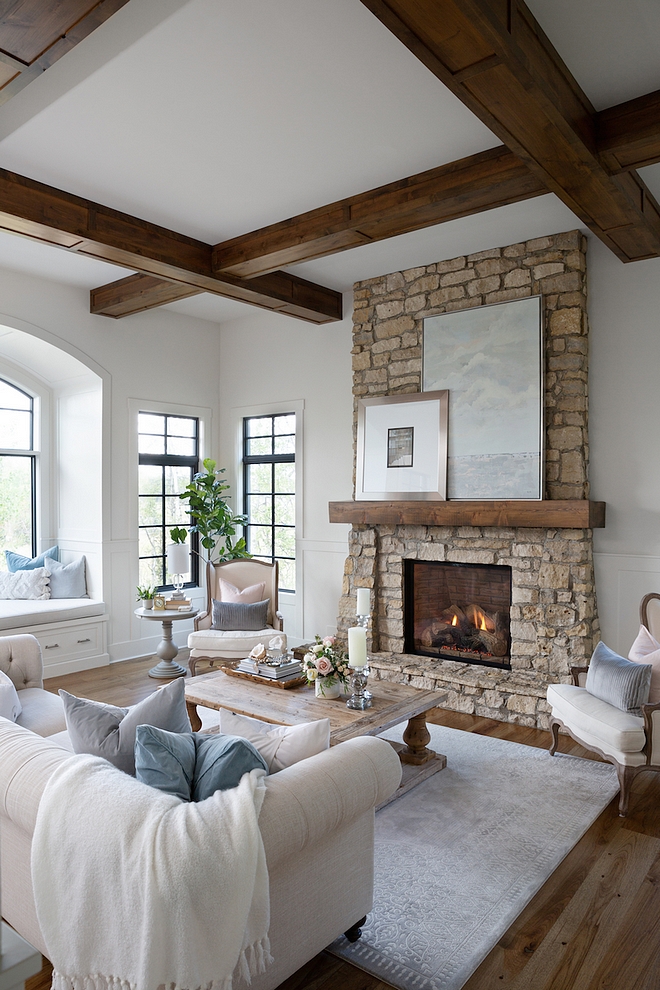 Fireplace TV Hidden Ideas The TV in this space is rarely used, so we often cover it up by leaning art on the mantle It helps emphasize the high ceiling height in this room and nicely balances this grand fireplace #Fireplace #fireplaceTV