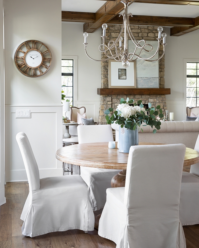 French inspired Breakfast room with Mango wood round dining table and white slipcovered dining chairs from Ikea French inspired Breakfast room with Mango wood round dining table #FrenchBreakfastroom #rounddiningtable