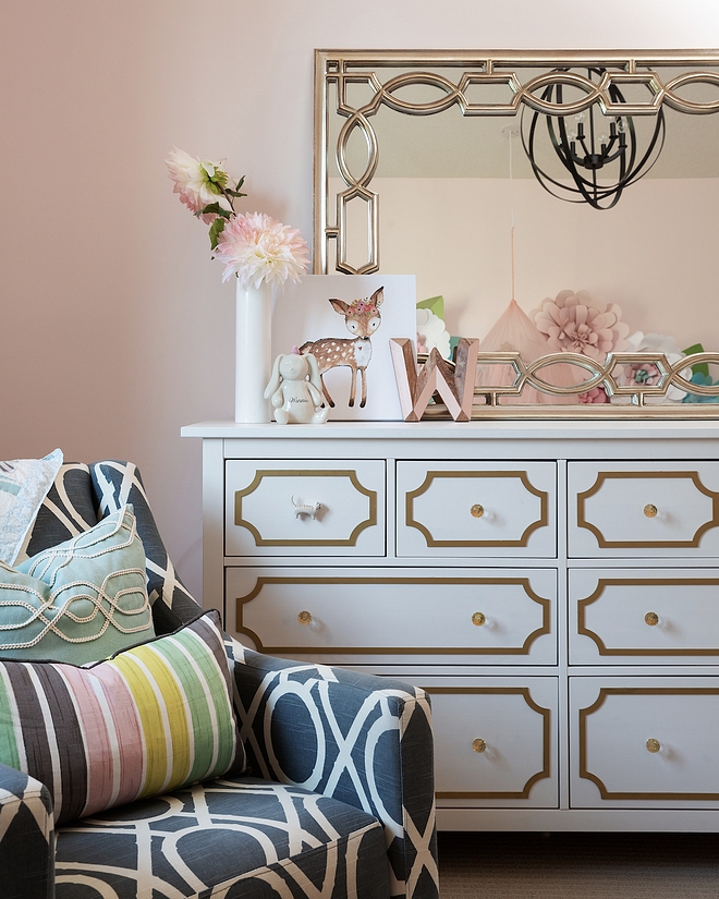 The dresser is originally from IKEA, and we added the custom gold molding details to ensure it was cohesive with the room