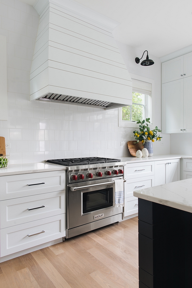 Shiplap Hood White shiplap hood The builder did a custom designed asymmetrical shiplap hood. They tapered the sides of the hood a bit so that it wood flair slightly at the bottom The ends of the island match the hood design #ShiplapHood #Whiteshiplaphood #kitchenhood