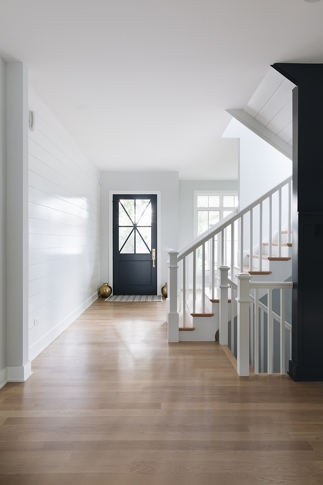 Classic staircase with painted posts railings and spindles with White Oak treads #Classicstaircase #staircaseposts #railings #spindles #WhiteOaktreads