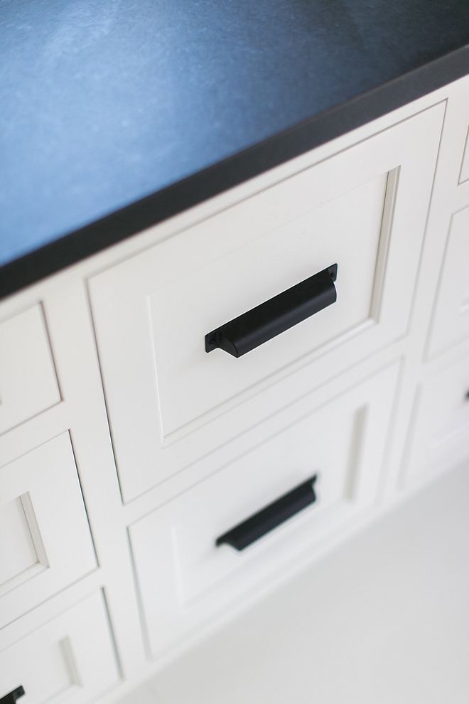 Benjamin Moore White Dove with leathered black granite countertop and black matte cabinet hardware