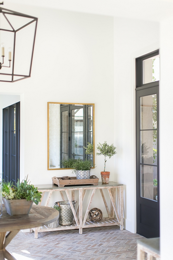 Modern farmhouse foyer with reclaimed console table and herringbone brick flooring Modern farmhouse foyer Modern farmhouse foyer #Modernfarmhouse #Modernfarmhousefoyer #foyer