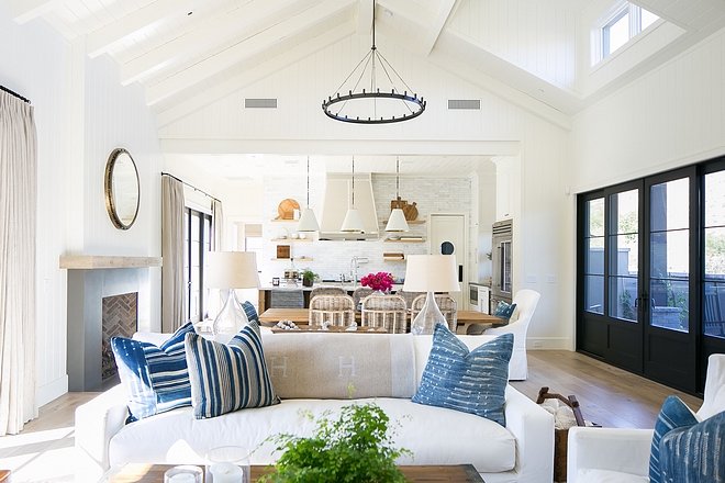 Blue and white color scheme Blue is the current accent color throughout the home, showing up on pieces like the upholstery of the kitchen bar stools and the throw pillows in a living area #blueandwhite #colorscheme
