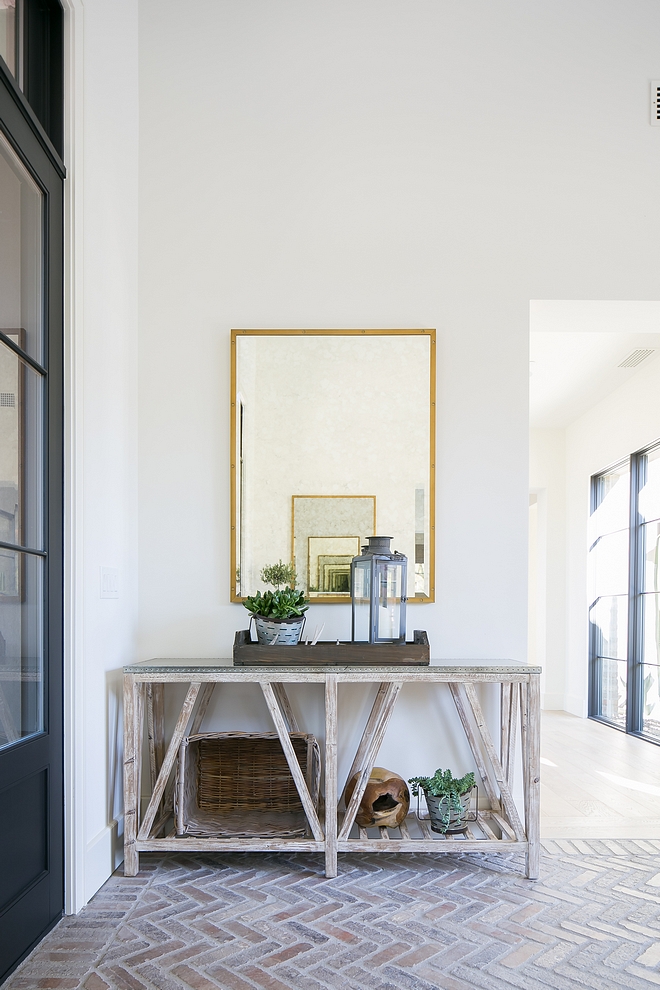 Wooden base console table with zinc top Foyer decor ideas Wooden base console table with zinc top with brass mirror and rustic decor #Woodenbase #consoletable #foyer