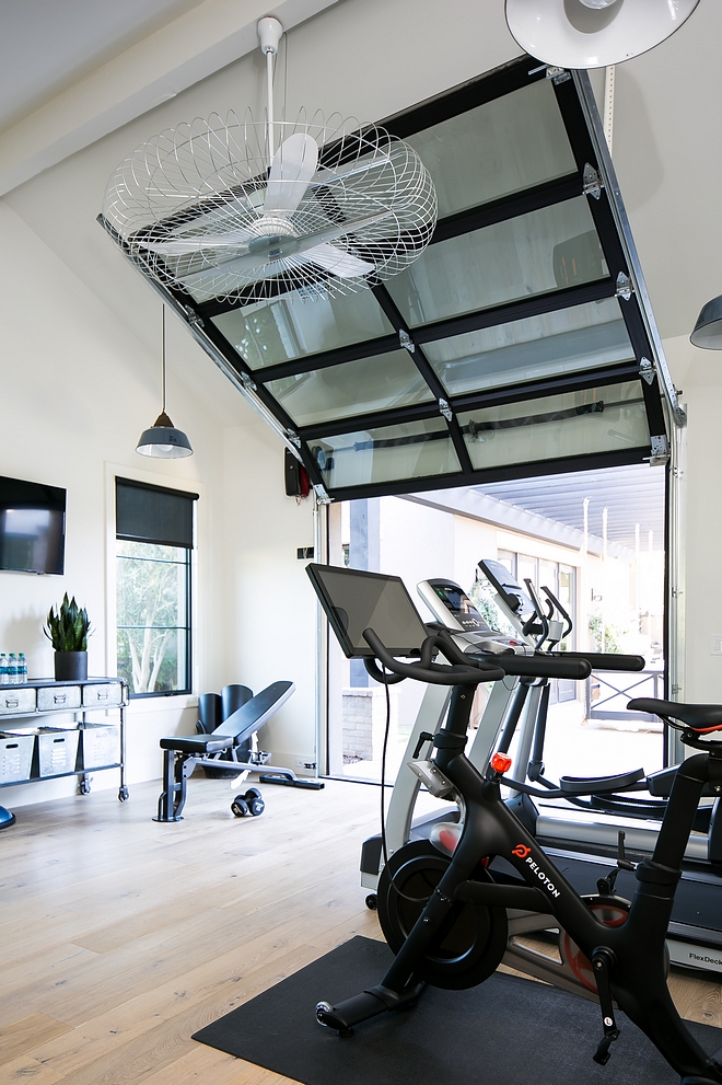 Home gym with glass and steel garage door