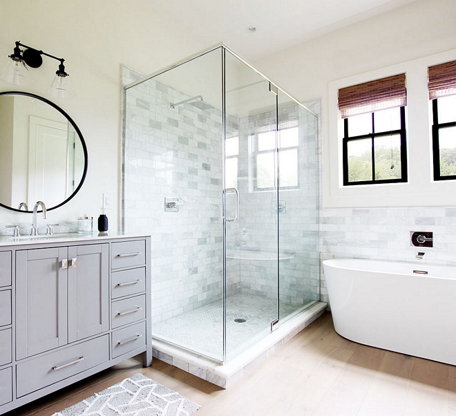 Shower Shower Tile The master bathroom features a large shower with marble subway tile and herringbone floor tile Remaining flooring is hardwood #shower #showertile #whitemarbletile