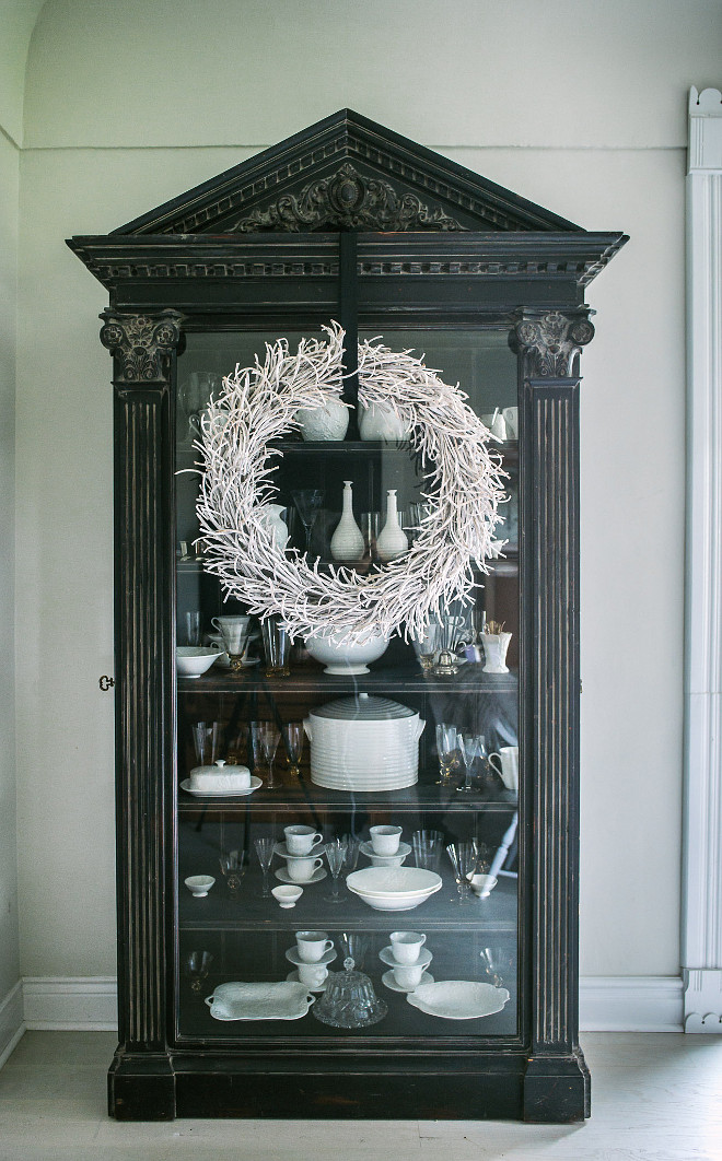 Sometimes high impact can be achieved through simplicity… a wreath hung with wide black ribbon is all that was needed to dress my china cabinet