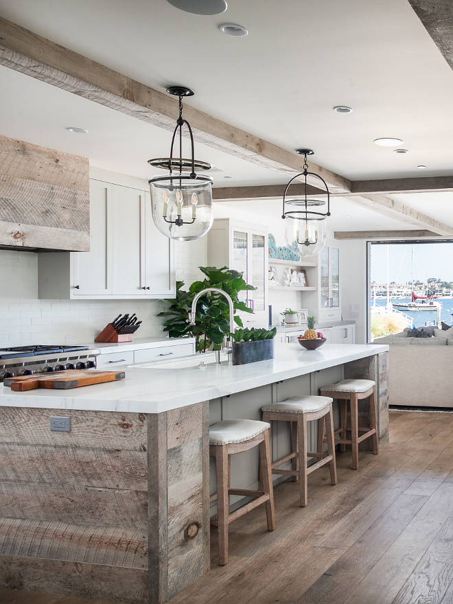 Rustic Kitchen island with reclaimed shiplap and Michaelangelo Calcutta honed countertop Rustic Kitchen island with reclaimed shiplap, reclaimed shiplap hood and reclaimed wood beams #RusticKitchen #reclaimedshiplap