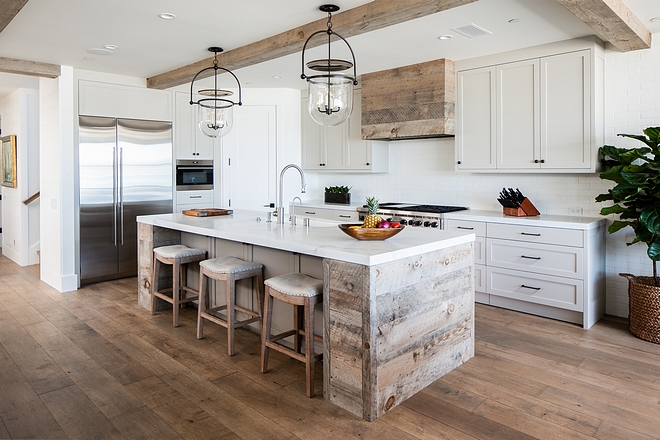 Kitchen Cabinetry A combination of white oak vertical grain, paint grade oak and Natural aged reclaimed wood. Shaker style doors and drawer fronts. Soft close hinges and drawer guides Touch latch drawers in toe kicks to maximize storage Touch latch hidden doors on each end of island #KitchenCabinetry #Kitchen