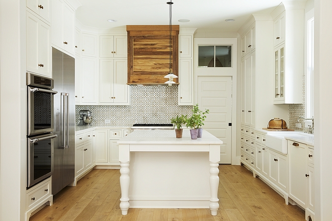 White Kitchen Floor-to-ceiling cabinets create a seamless and classic look to this kitchen All walls are painted in Sherwin Williams SW7637 Oyster White White Kitchen #WhiteKitchen #kitchen #paintcolor #kitchenpaintcolor #kitchencabinets #cabinets