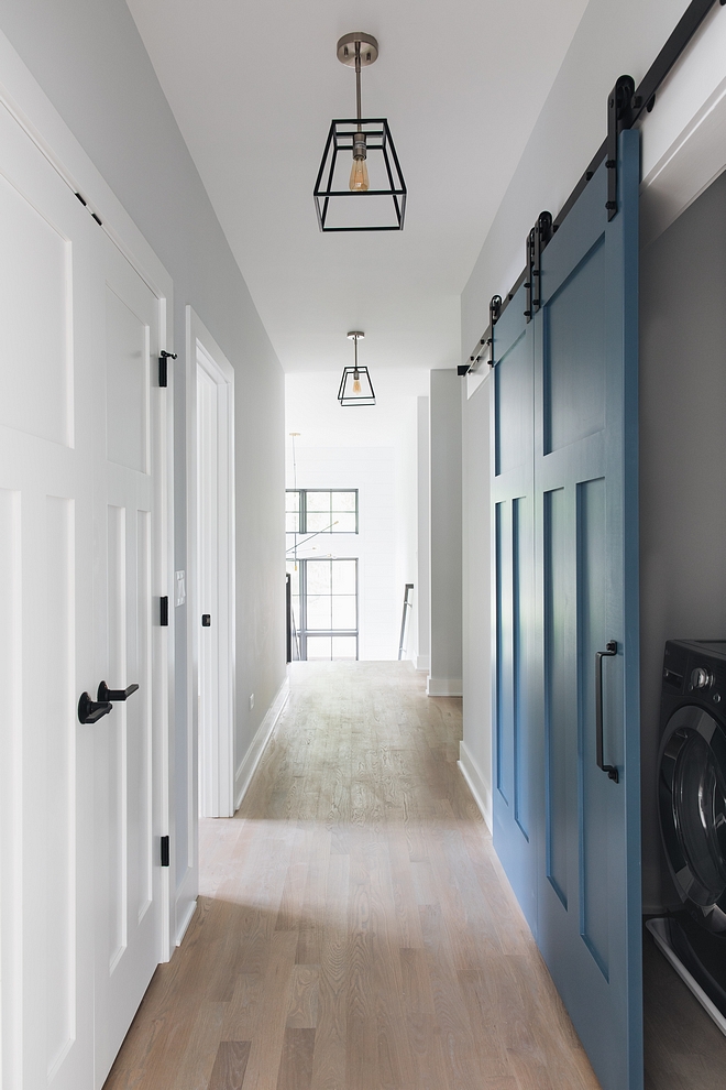 Blue barn door Laundry room with blue grey barn door Barn door painted in blue Barn door #barndoor #bluebarndoor #laundryroombarndoor #laundryroom