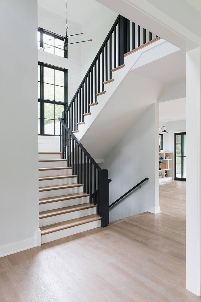 Black Railing Staircase Modern farmhouse staircase black railing black spindles shiplap The staircase features black spindles and railings to match the black windows #BlackRailing #Staircase #Modernfarmhousestaircase #blackrailingstaircase #shiplap