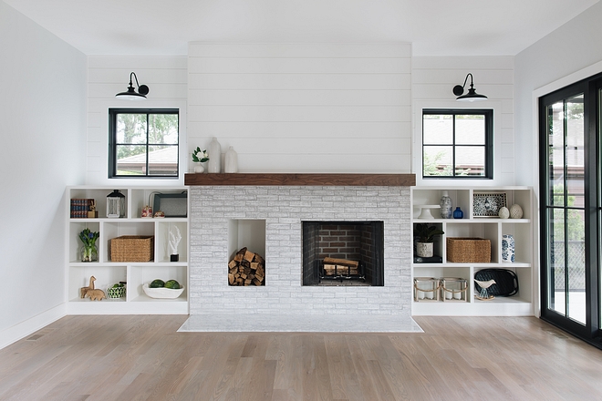 Farmhouse Fireplace with wood storage The fireplace features a brick-style tile and a dedicated wood storage space Modern farmhouse fireplace with log storage #farmhousefireplace #fireplace #woodstoragefireplace #fireplacewoodstorage #logstorage