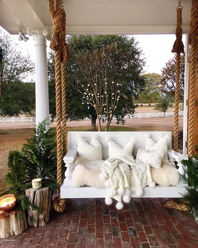 Porch swing rope handle porch swing with pompom throw and pompom pillows Porch swing rope handle Porch swing rope handle ideas #Porchswing #ropeporchswing #porch #swing