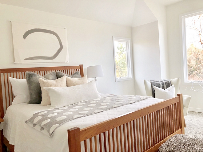 Benjamin Moore Simply White Benjamin Moore Simply White The master bedroom wall is a satin Benjamin Moore Simply White White bedroom paint color Benjamin Moore Simply White #BenjaminMooreSimplyWhite