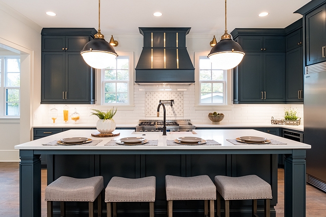 Kitchen island The center island comfortably seats 4, perfect for casual dining A designer faucet catches your eye as you glance upon this stylish kitchen Note the picture frame tile accent above the range Kitchen island #Kitchenisland