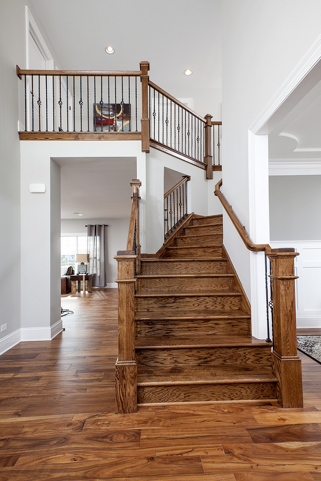 Oak Staircase Treads and posts A custom Oak staircase adds warmth and architectural interest to this home #Oakstaircase #Staircase