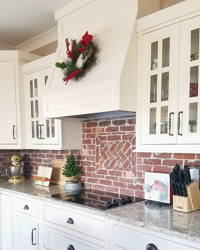 White kitchen with brick backsplash The shaker style cabinets are recessed - painted SW 7008 Alabaster by Sherwin Williams White kitchen with Chicago brick backsplash #Whitekitchen #brickbacksplash