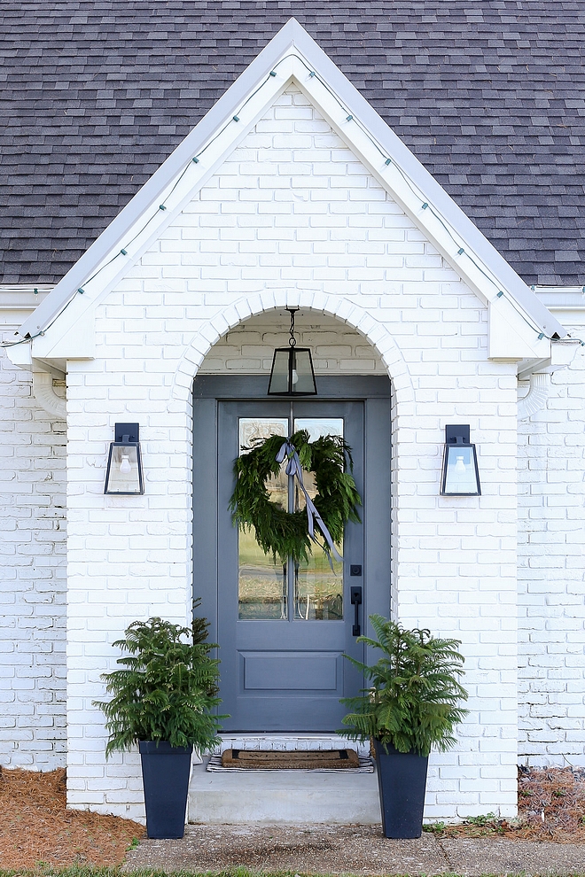 Sherwin Williams SW 7005 Pure White Painted brick exterior with grey front door Brick paint color Sherwin Williams SW 7005 Pure White #SherwinWilliamsSW7005PureWhite #paintedbrick #brick #whitebrickpaintcolor #paintingbrickexterior #exteriorbrick #brickexterior #exterior