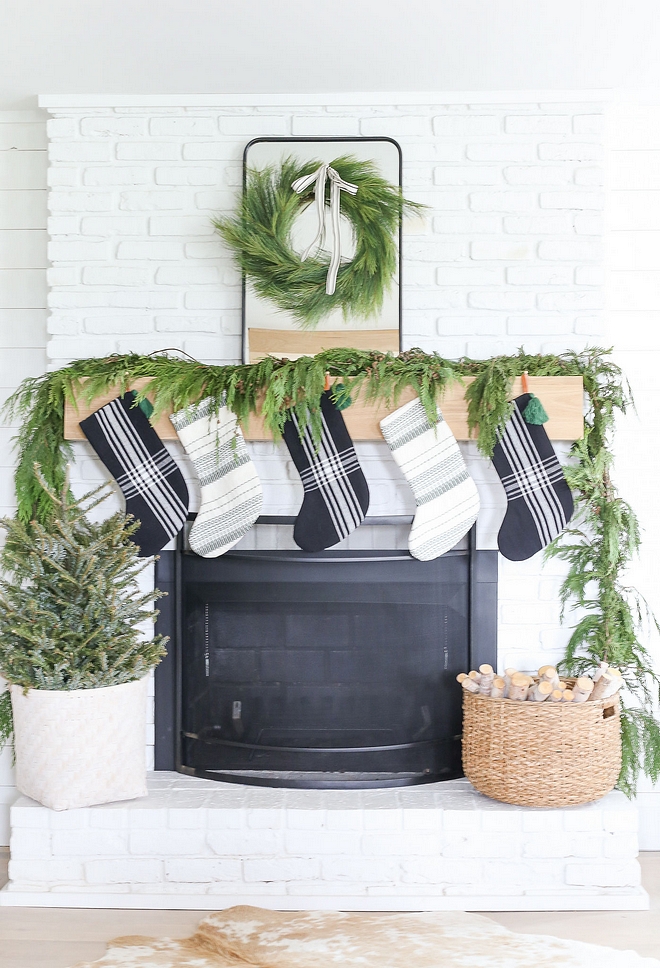 Painted brick fireplace with White oak mantel The White Oak mantel was custom-designed by the homeowner and it looks great against the painted brick #Paintedbrickfireplace #Whiteoakmantel