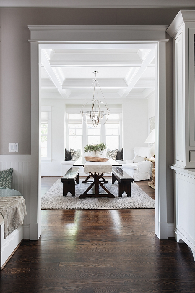 Dining room off kitchen with dining room benches and traditional coffered ceiling This is a large rectangular room filled with windows on three sides Dining room #Diningroom #diningbenches #diningbench #cofferedceiling