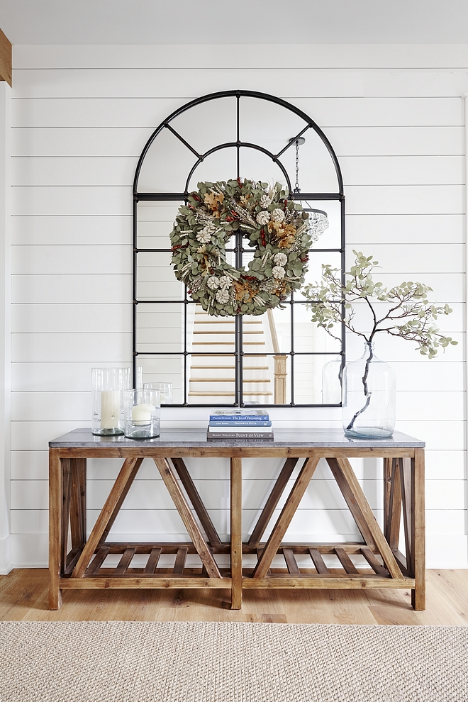 Benjamin Moore White Dove The front door opens to a breathtaking foyer with white shiplap walls, painted in Benjamin Moore White Dove, and beautiful decor #BenjaminMooreWhiteDove