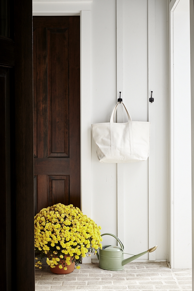 Brick flooring with board and batten walls Mudroom Brick flooring with board and batten walls painted in Benjamin Moore White Dove Best mudroom design ever #mudroom #Brickflooringmudroom #boardandbatten