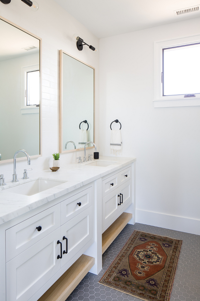 Modern Farmhouse bathroom with double vanity Cabinets are Shaker-style face framed with bottom white oak shelves #bathroom #doublevanity #Cabinet #Shakerstylecabinet #faceframedcabinet #whiteoakshelves