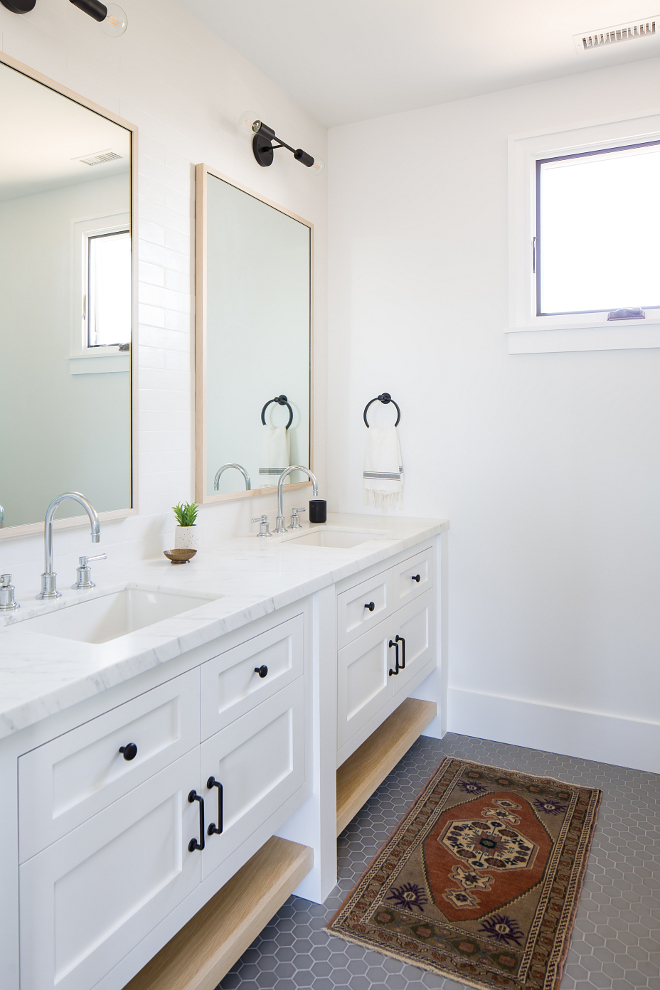 Modern Farmhouse bathroom with double vanity Cabinets are Shaker-style face framed with bottom white oak shelves #bathroom #doublevanity #Cabinet #Shakerstylecabinet #faceframedcabinet #whiteoakshelves