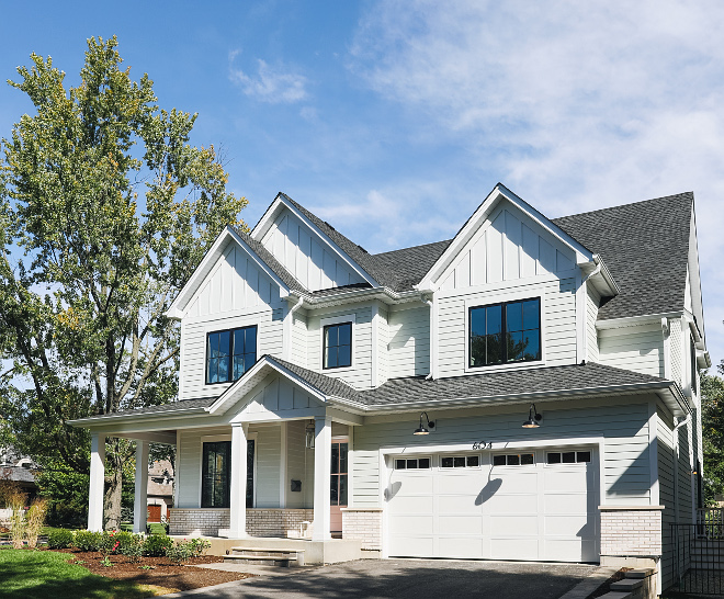 Modern farmhouse with front porch This home is not big and it could work on any lot - not only on a corner lot. Notice the board-and-batten siding, the front porch and the brick accent #home #cornerlothome #cornerlot #modernfarmhouse #farmhouse