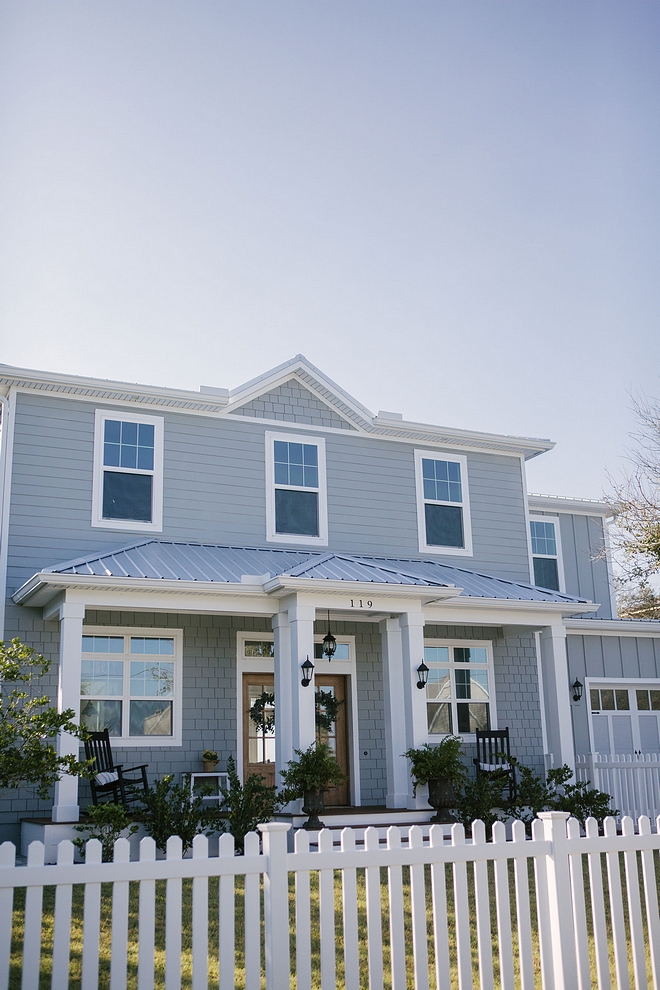 The grey exterior paint color is Behr Sharkskin PPU25-04 Behr Sharkskin Modern farmhouse with grey exterior, white picket fence and metal roof grey exterior paint color is Behr Sharkskin PPU25-04 Behr Sharkskin grey exterior paint color is Behr Sharkskin PPU25-04 Behr Sharkskin #greyexterior #greyexteriorpaintcolor #BehrSharkskinPPU2504 #BehrSharkskin