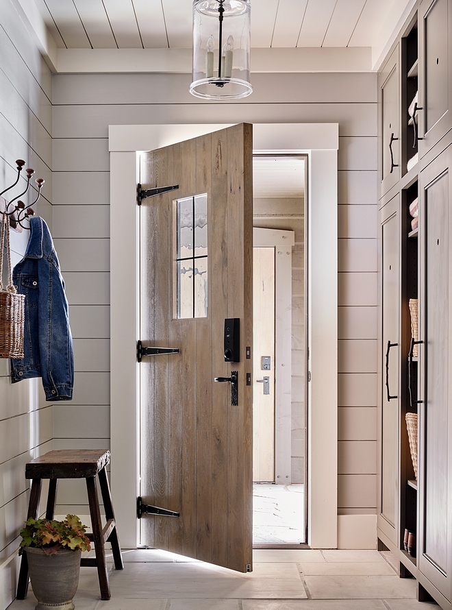 Shiplap Mudroom Mudroom with shiplap walls, shiplap ceiling, Bluestone pavers, custom White Oak door and White Oak cabinet #mudroom #shiplap #Bluestone #WhiteOakdoor #Shiplapmudroom #WhiteOakcabinet