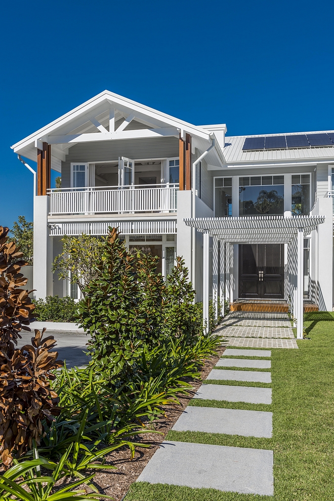 Beach House Architecture We used tin roof and weatherboard, so it picks up the Brisbane vernacular, then we've spiced it up a little bit There are traditional elements with Colonial and Caribbean influences as well Beach House Architecture #BeachHouse #BeachHouseArchitecture