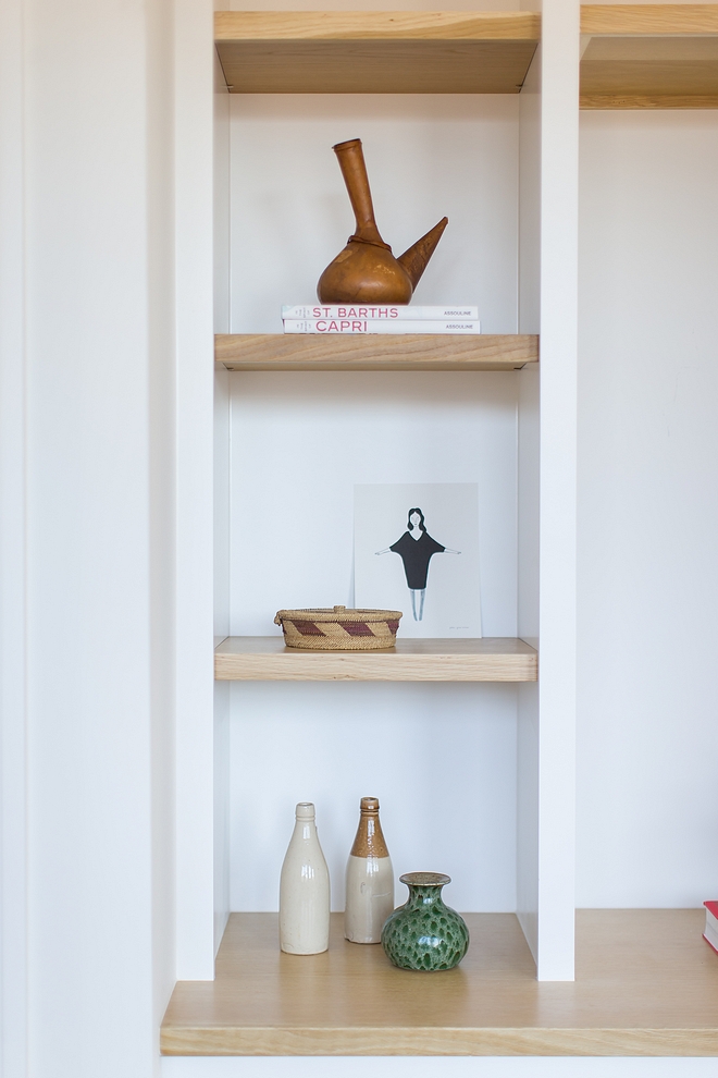 On built-ins the builder combined shaker style paint grade cabinets with contrasting White Oak tops and shelves