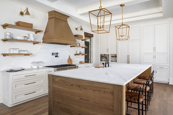 Kitchen Cabinetry Color Benjamin Moore White Dove Custom inset cabinetry fills this kitchen and provides for ample storage space. A cabinet front Refrigerator is hidden where the tall pair of doors are on the center of the wall of cabinetry #Kitchen #Cabinetry #kitchencabinetry #BenjaminMooreWhiteDove #Customcabinet #customkitchencabinet #insetcabinetry